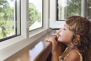 little-girl-looking-through-a-window