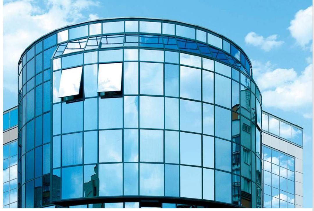 Top hung aluminium windows standing open on a curved glass facade